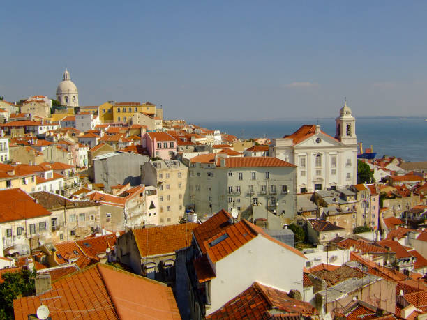 Lisbon's Alfama district skyline, with the Sao Vicente de Fora church rising above the rooftops, Lisbon Portugal.