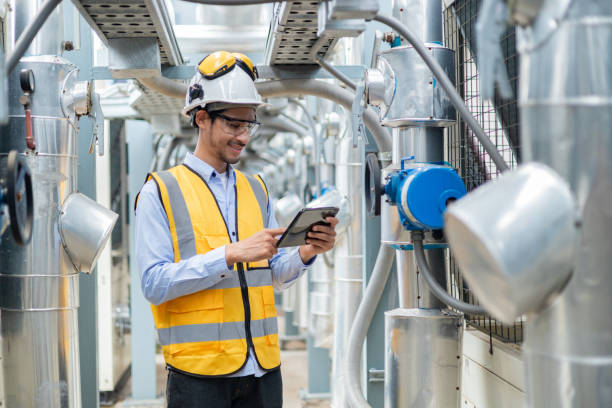 Electrical Engineer Monitoring Systems on Laptop