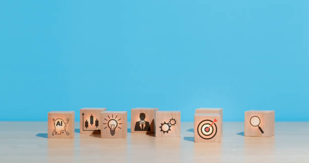 istock wooden cube with dart board target icon on table , concept of target and goals achieved, creativity Effective business operations through strategies to achieve the best results of targeted business 2158438150