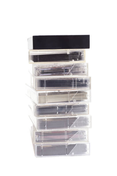 istock Stack of vintage audio cassettes isolated on white. 2158441095