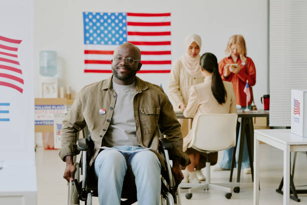 istock Black Voter With Disability At Polling Station 2158441714