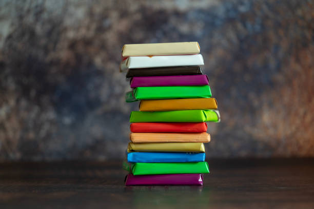 istock Different kind of chocolates and sweets on wooden background. 2158441722