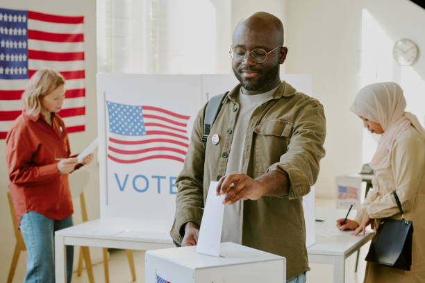 istock Cheerful Black Citizen Voting On Election Day 2158441804