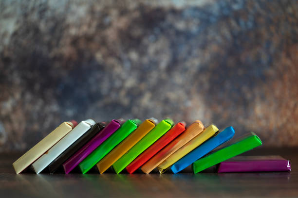 istock Different kind of chocolates and sweets on wooden background. 2158442394