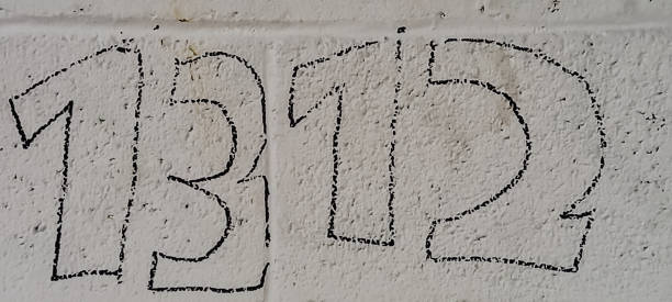 istock black painted numbers on a gray brick wall 2158446656