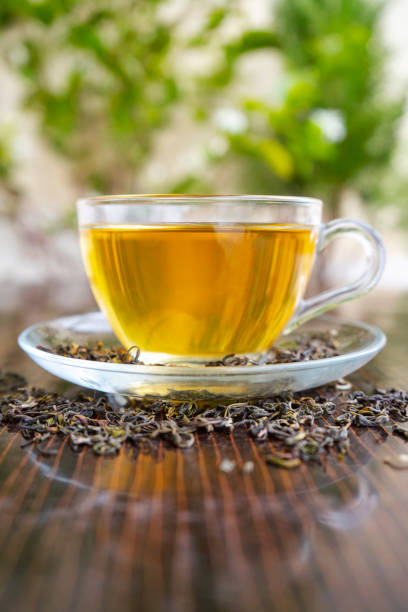 istock Green Tea in a tea cup Leaf Green tea leaves Organic Tea 2158446708