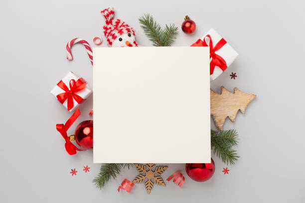 istock Greeting card mockup with christmas decor on color background, top view 2158448293