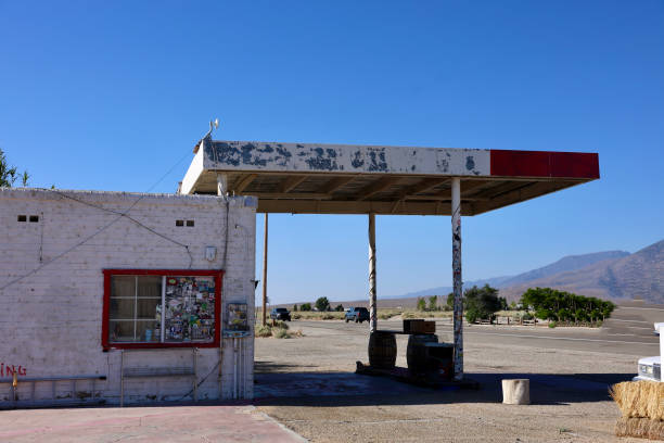 istock Abandoned gas station along the desert road 2158449316