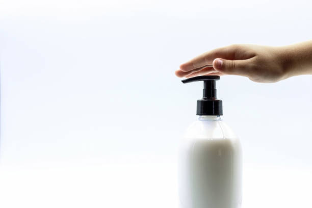 istock Hand hygiene concept. A child's hand on a soap bottle. 2158449577