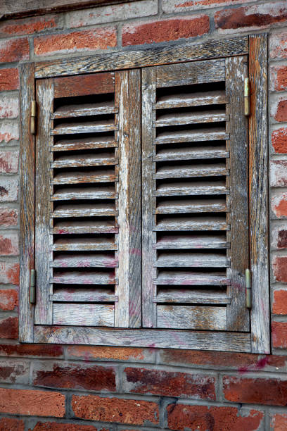Weathered and closed wooden shutter