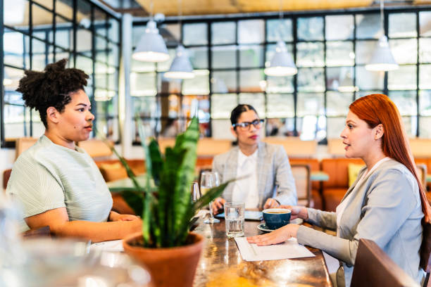 Businesswomen talking during meeting at restaurant
