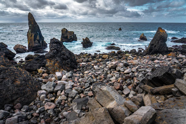 Rough rocky seashore and dark sea