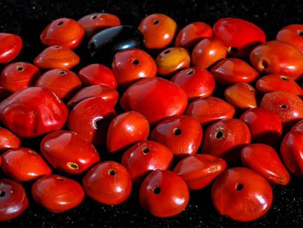 istock A pile of red beads with black dots on them 2158453950