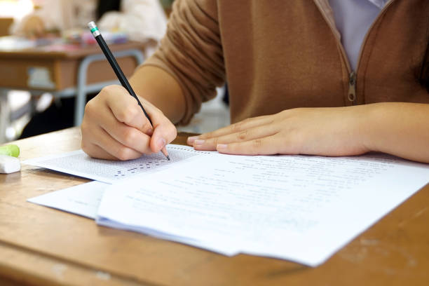 istock Asian students are taking exams to measure learning in the classroom. Soft and selective focus. 2158454159