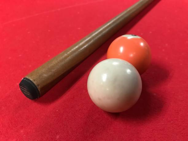 istock Pool table. Snooker game. Red pool table. Pool cue and ball. White and orange ball 2158455495