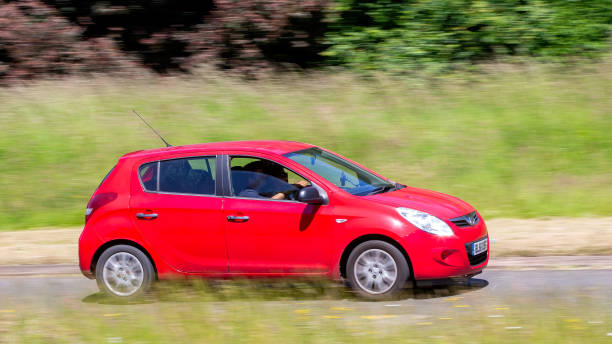 Hyundai i20 car Milton Keynes,UK - June 20th 2024: 2012 red Hyundai i20 car driving on a British country road 2012 stock pictures, royalty-free photos & images