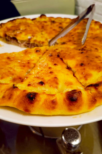 istock Georgian pie with meat. Close-up, vertical photograph. 2158459802