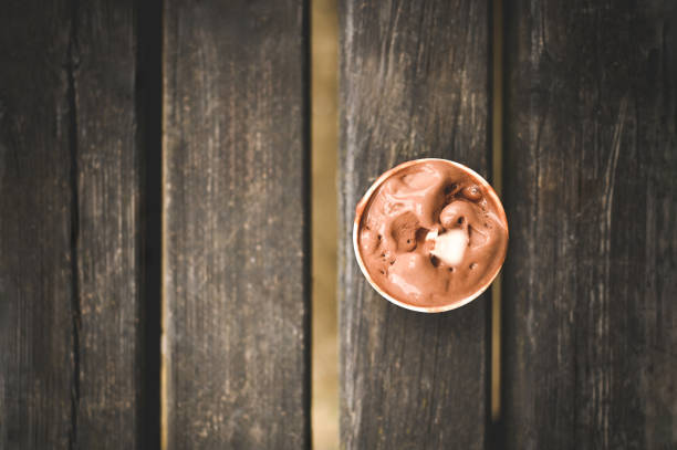 Close-up of a scoop of ice cream on spoon at ice cream shop