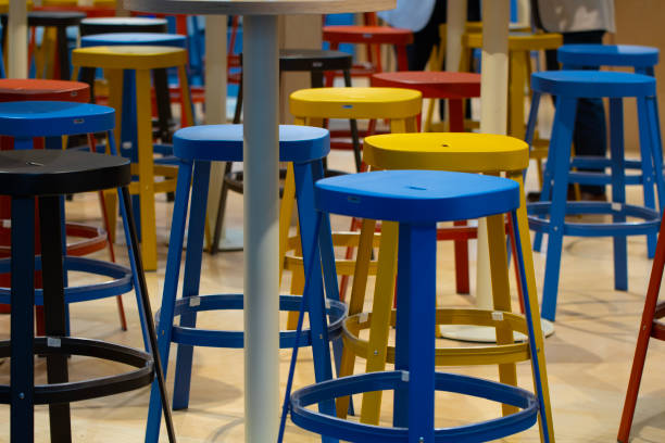 istock A row of colorful stools are arranged in a room 2158462955