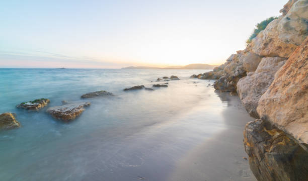 istock Rocks in the water in Sardinia at sunset 2158468548