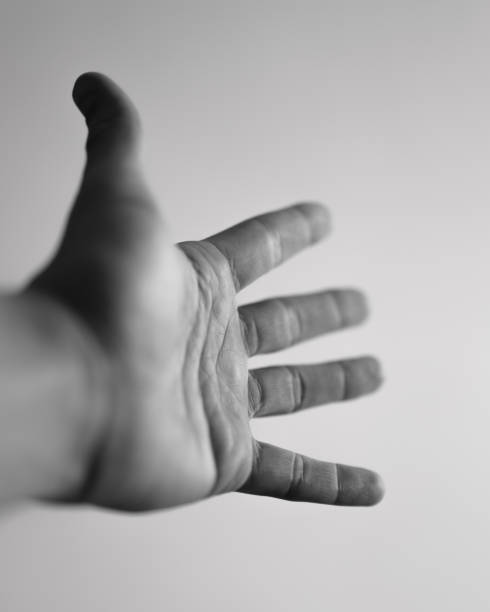 istock Reaching hand in a dynamic motion towards the viewer 2158473188