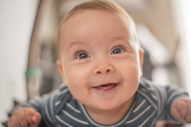 istock Happy 5-months-old lying on his stomach. tummy time 2158476501