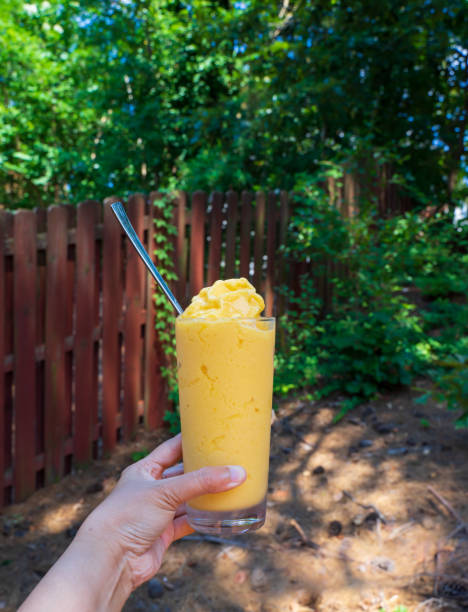istock Mango smoothies or milk shake with fruits during hot temperature season 2158478710