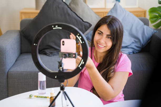 istock influencer recording video blog with cosmetics using ring light 2158482233