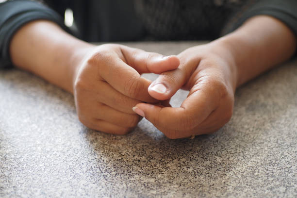 istock Young woman hands suffering pain in thumb finger 2158482569