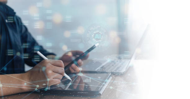 istock Technology AI assistance and business digital data, business people using smartphone and working on digital tablet and laptop computer. 2158491022
