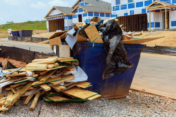 istock When house is being constructed, a metal garbage container is used to dispose of construction waste 2158496959