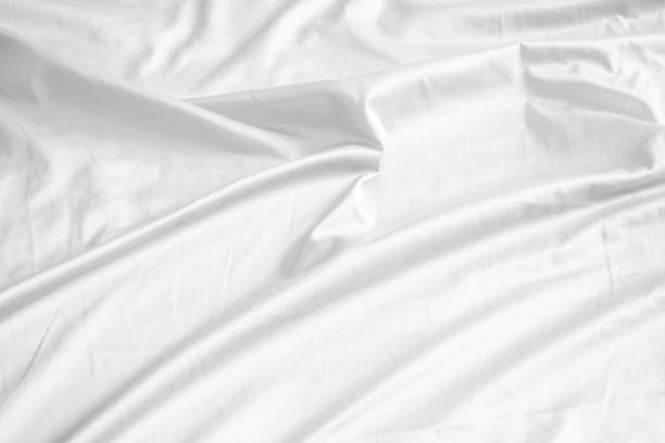 istock Abstract white wrinkled bedding sheet fabric texture background 2158502283