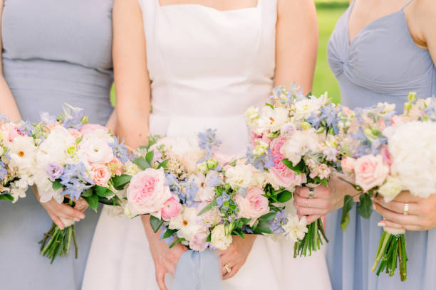 istock Bride and bridesmaids are holding wearing pretty wedding bouquets. 2158503250