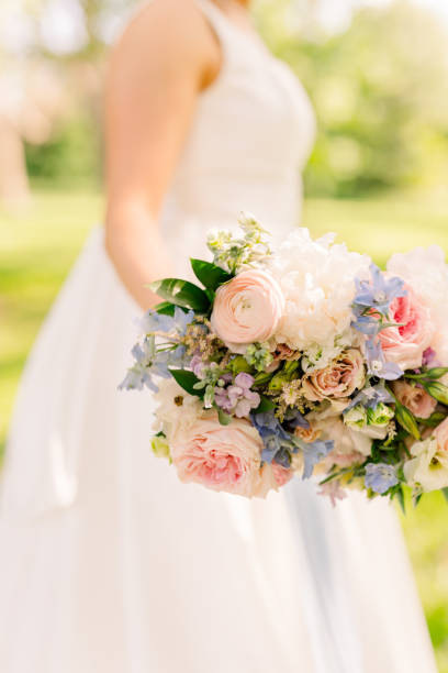 istock Bride is holding a summer bridal bouquet 2158503400