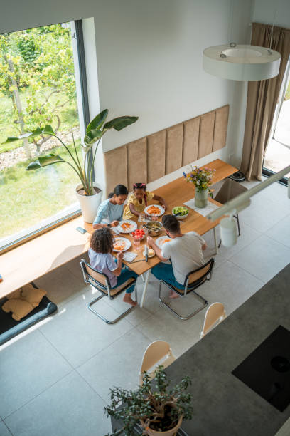 istock Multinational Family Savoring a Delicious Home-cooked Meal 2158503566
