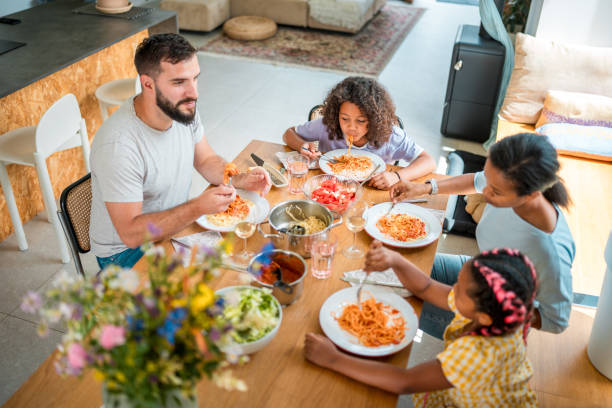 istock Harmonious Mealtime for a Mixed Race Household 2158503568