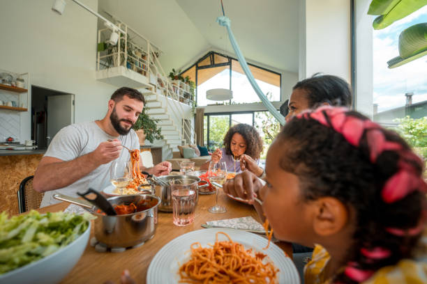 istock Diverse Household Sharing a Meal at Home 2158503569