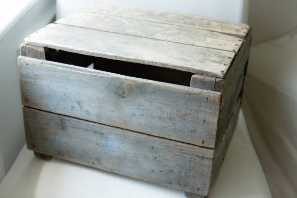 Closed wooden black box with latch at white table