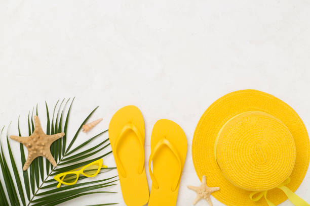 istock Flat lay with yellow summer outfit on concrete background. Vacation concept 2158510135