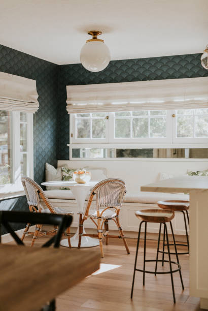 istock Bright dining room with wooden table 2158510233