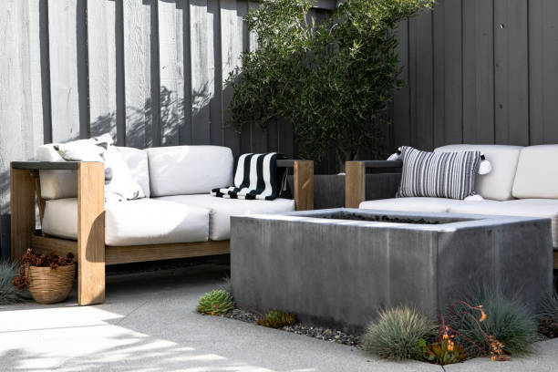 istock Outdoor wooden couch with a fireplace 2158510588
