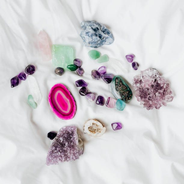 istock Colorful healing crystals on a blanket 2158512535