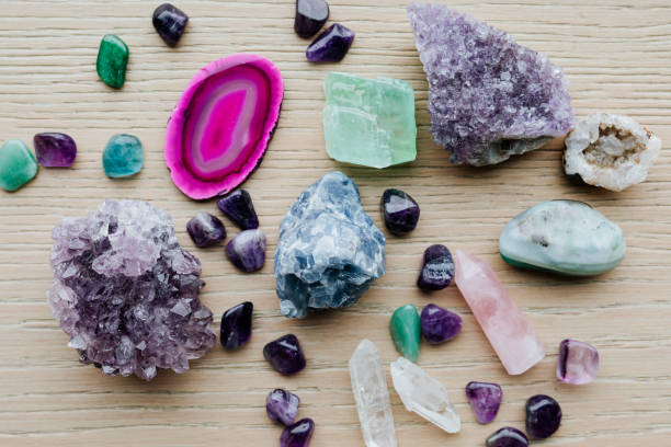 istock Colorful healing crystals on a wooden table 2158512541