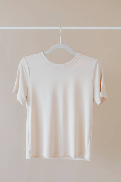 istock T-shirt mockup hanging on a clothing rack 2158512548