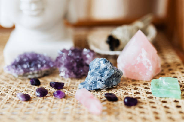 istock Colorful healing crystals on a wicker surface 2158512560