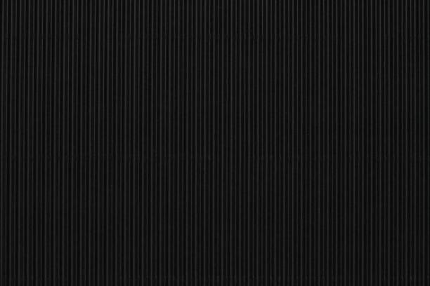 istock Black corrugated paper wallpaper background 2158514039