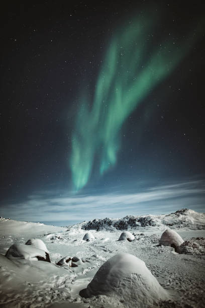 istock Northern lights over snowy Greenland 2158514217