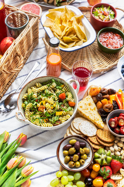 istock Summer picnic with pasta salad and snack board 2158514673