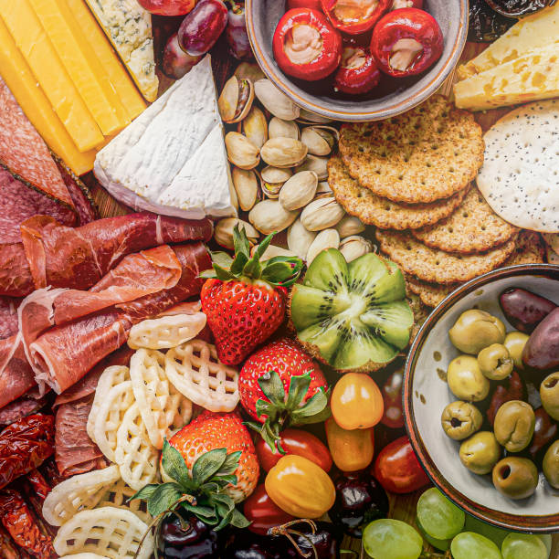 istock Charcuterie board with cold cuts, fresh fruits and cheese 2158514677