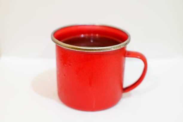Iron Red cup of coffe isolated above white background with copy space,caffein, stock drink.